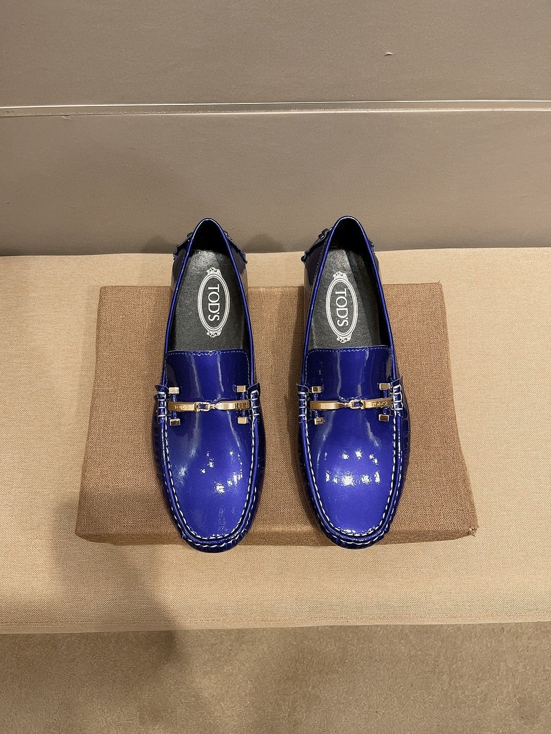Tod's Glossy Metal Bar Loafers — front