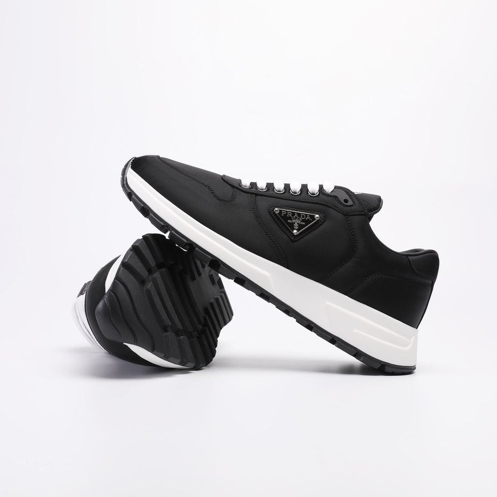 PRADA Navy Triangle Badge Sneakers — side