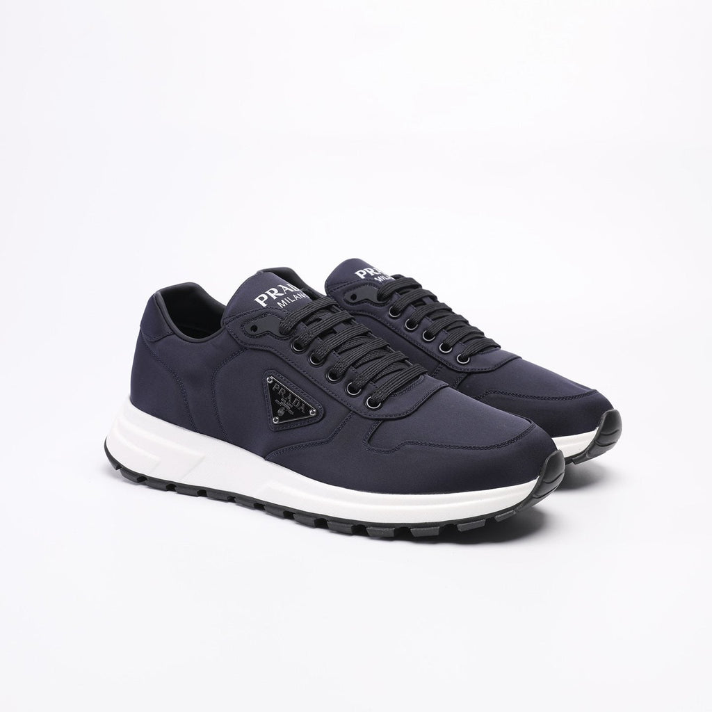 PRADA Navy Triangle Badge Sneakers — front