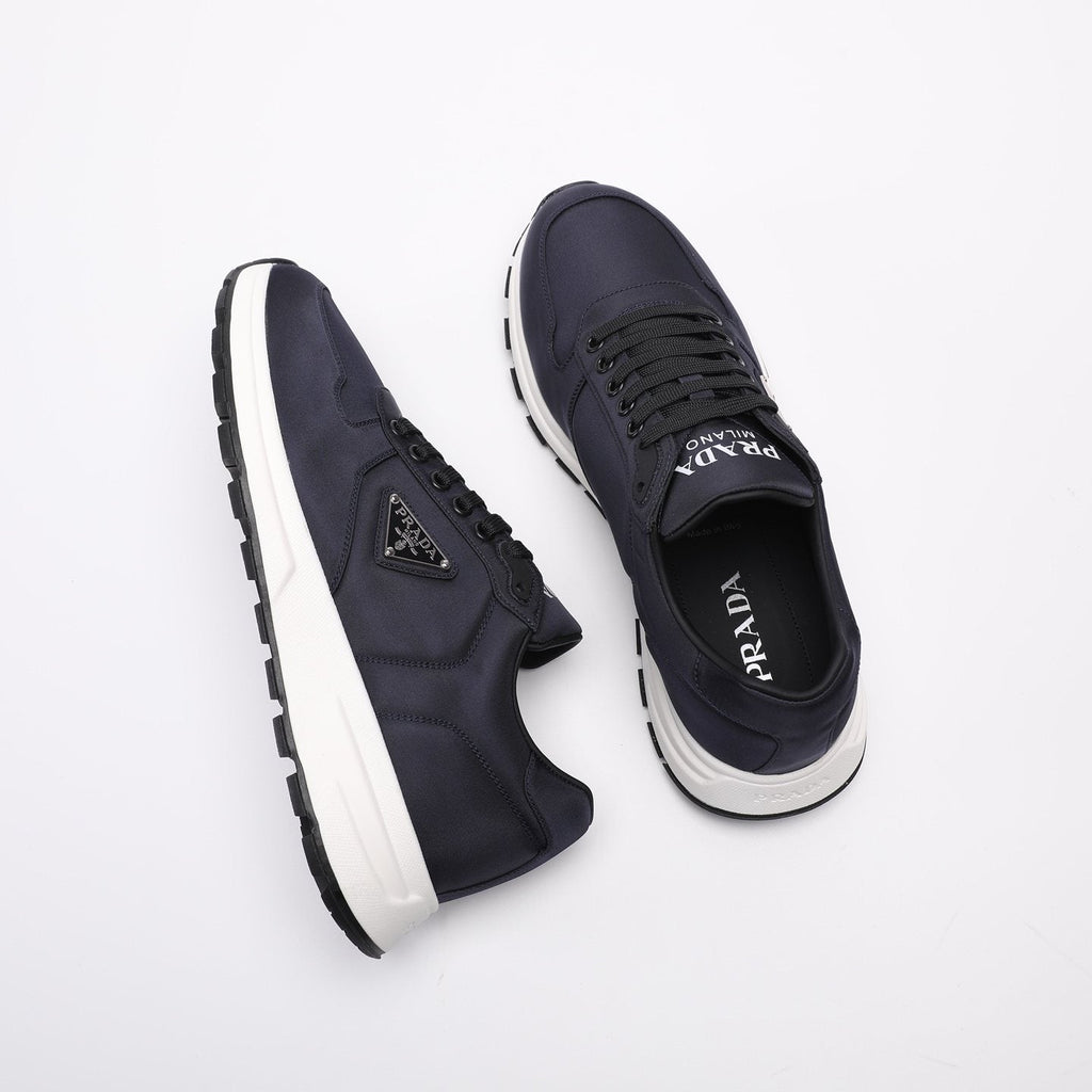 PRADA Navy Triangle Badge Sneakers — front