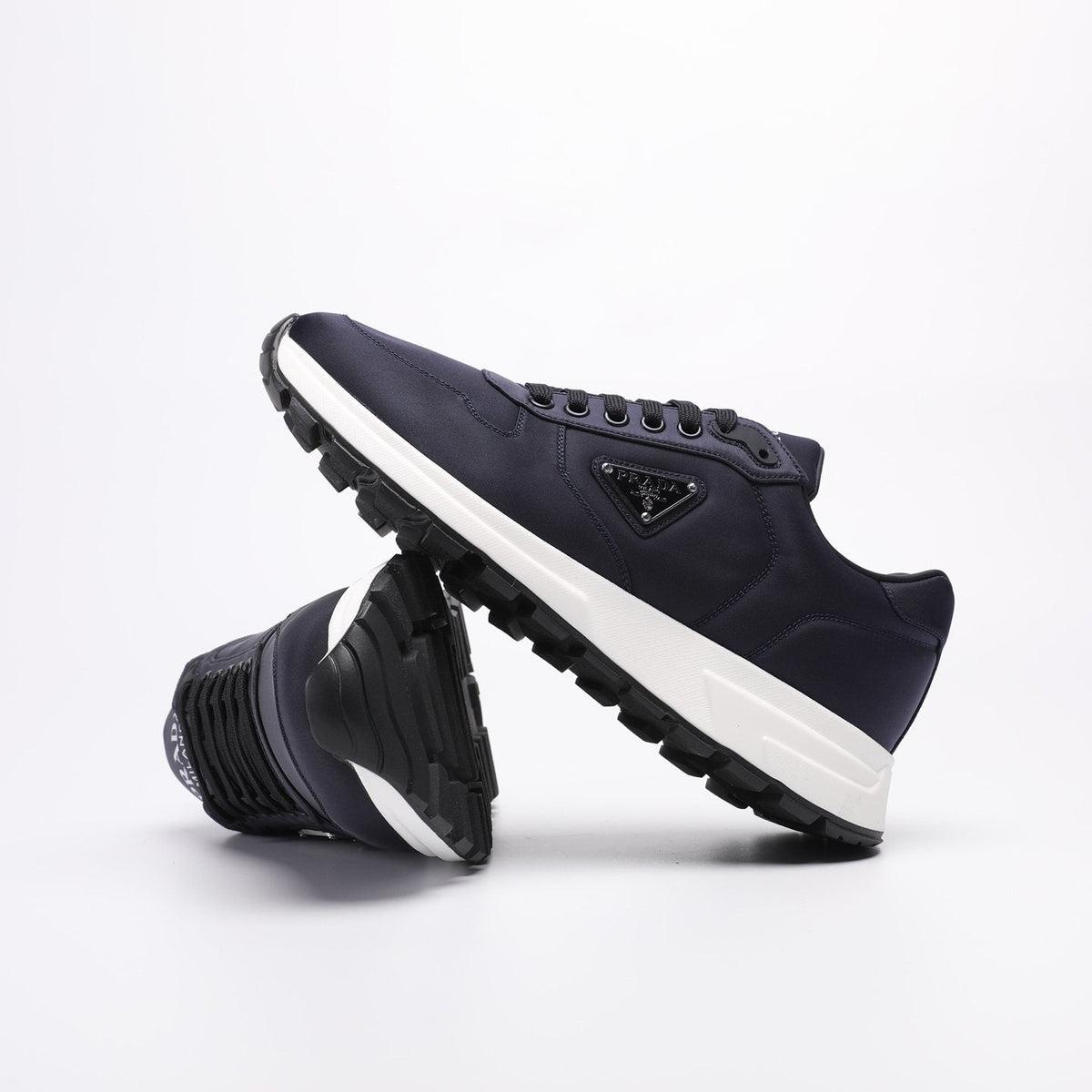PRADA Navy Triangle Badge Sneakers — side