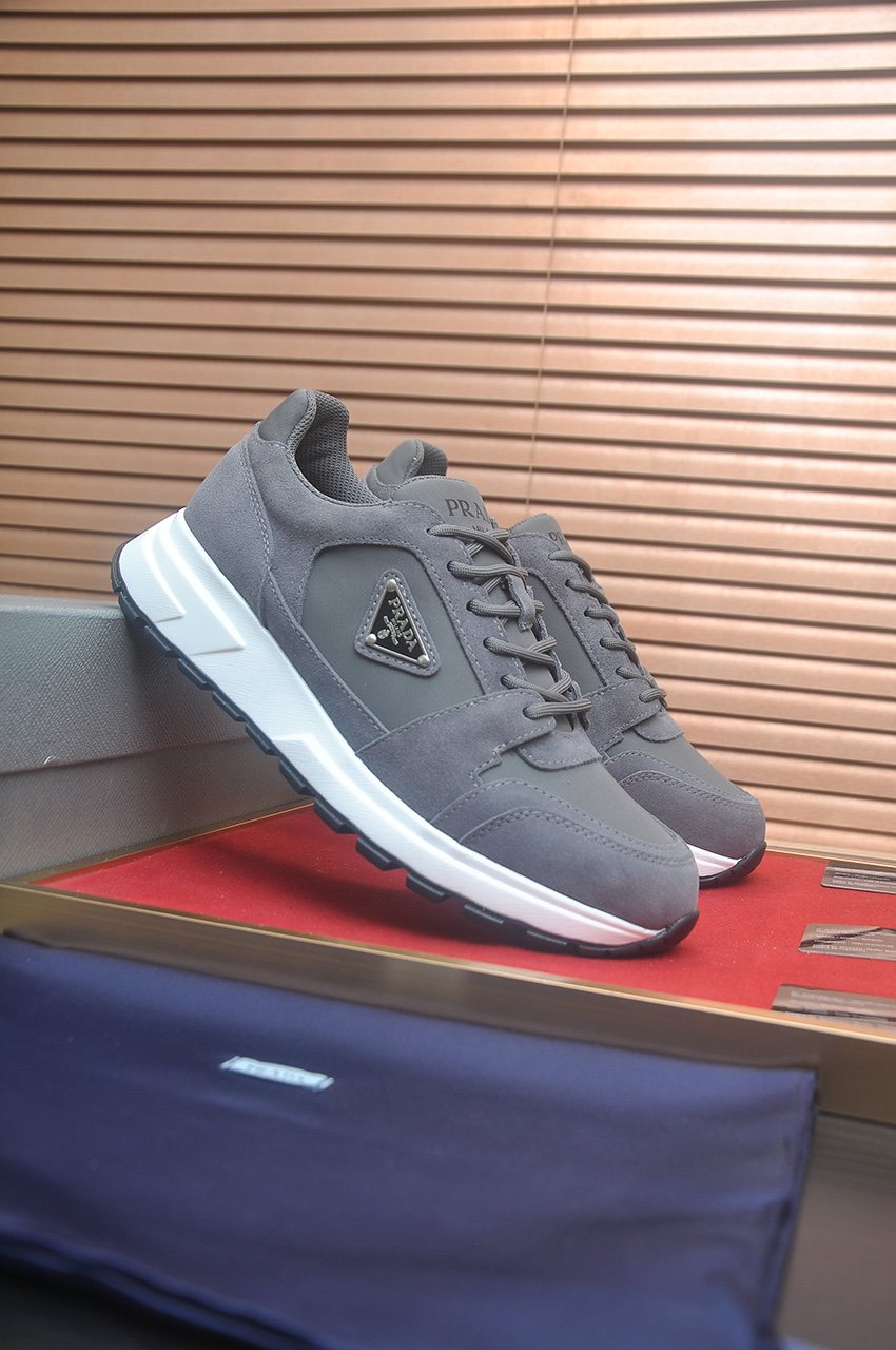 Prada Triangle Plaque Low-Top Sneakers — front
