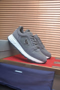 Prada Triangle Plaque Low-Top Sneakers — front