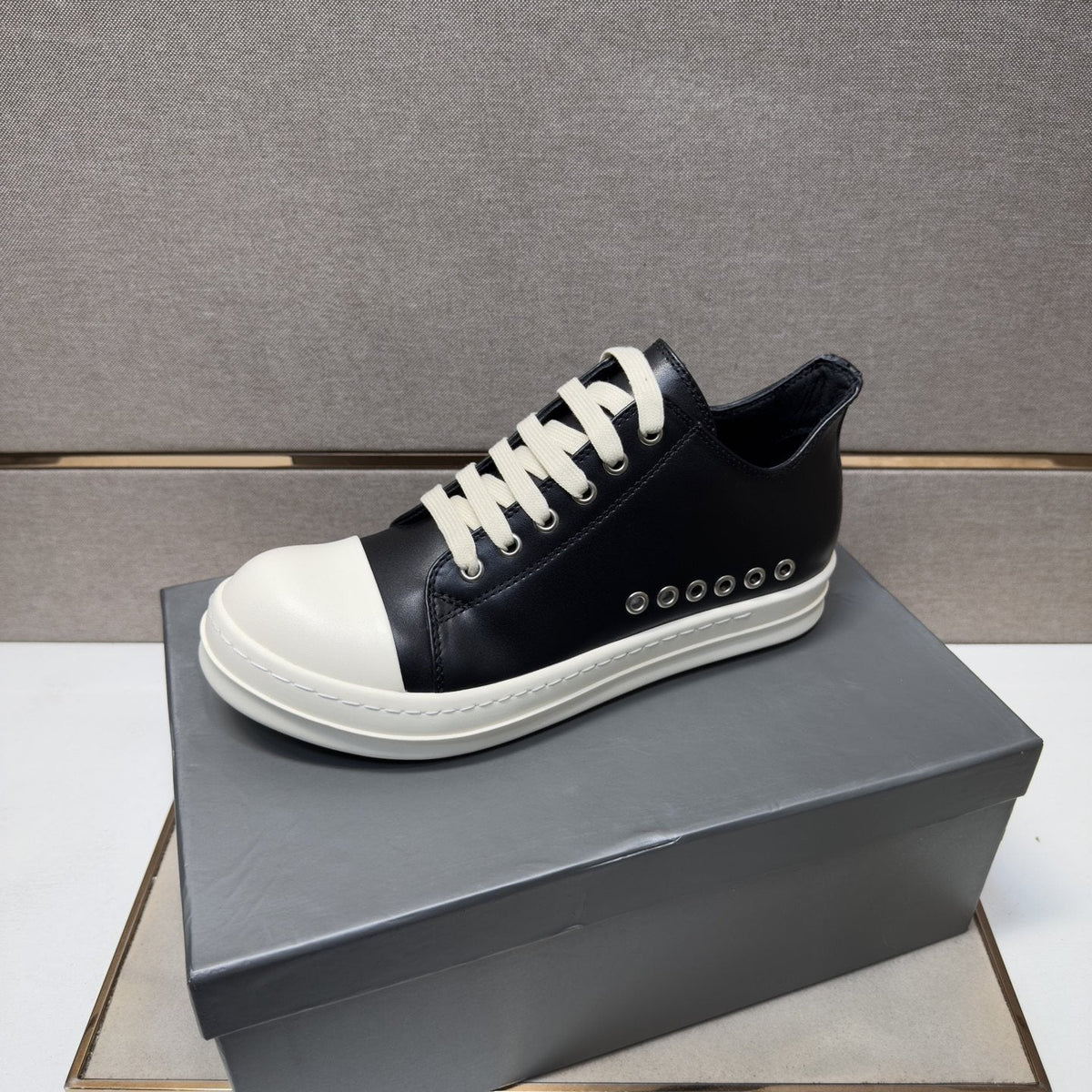Black and Off-White Low-Top Sneakers — hero