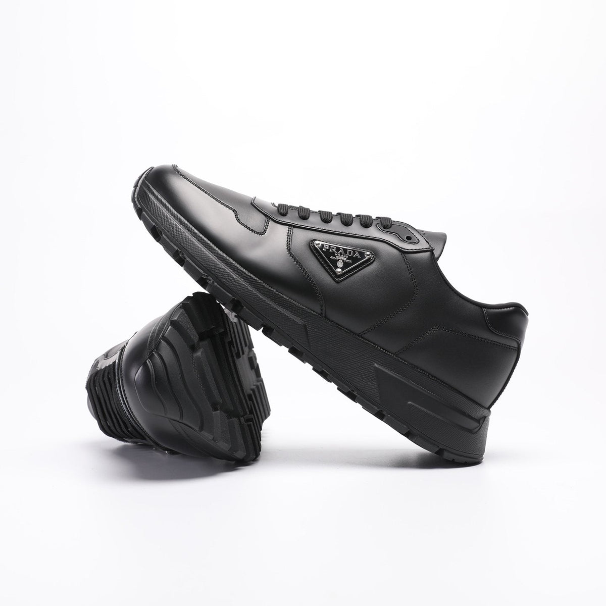 Prada Triangle Plaque Low-Top Sneakers — side