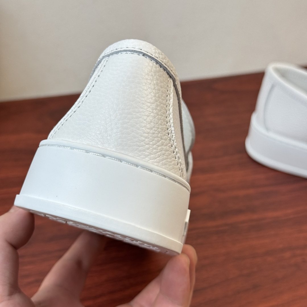 Louis Vuitton Textured Slip-On Loafers — back