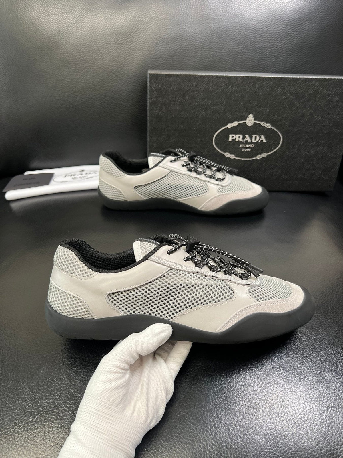 Prada White, Gray & Black Low-Top Sneakers — model
